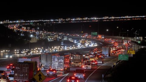 HESPERIA, CA - NOVEMBER 22: Pre-holiday traffic moves slowly on the Interstate 15 freeway through Cajon Pass, the primary route between Los Angeles and Las Vegas, on November 22, 2022 near Hesperia, California. An estimated 54.6 million people will travel 50 miles or more from home this Thanksgiving, 98% of pre-pandemic volumes, according to AAA. (Photo by David McNew/Getty Images) 